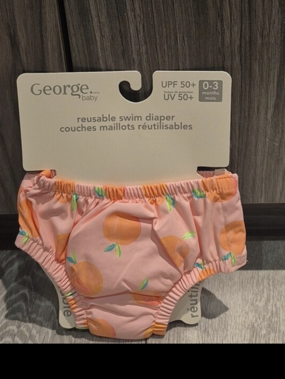 George Baby Pink Peach Print Reusable Swim Diaper With UPF 50+ Rating.